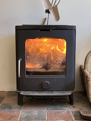 Log burner with firewood